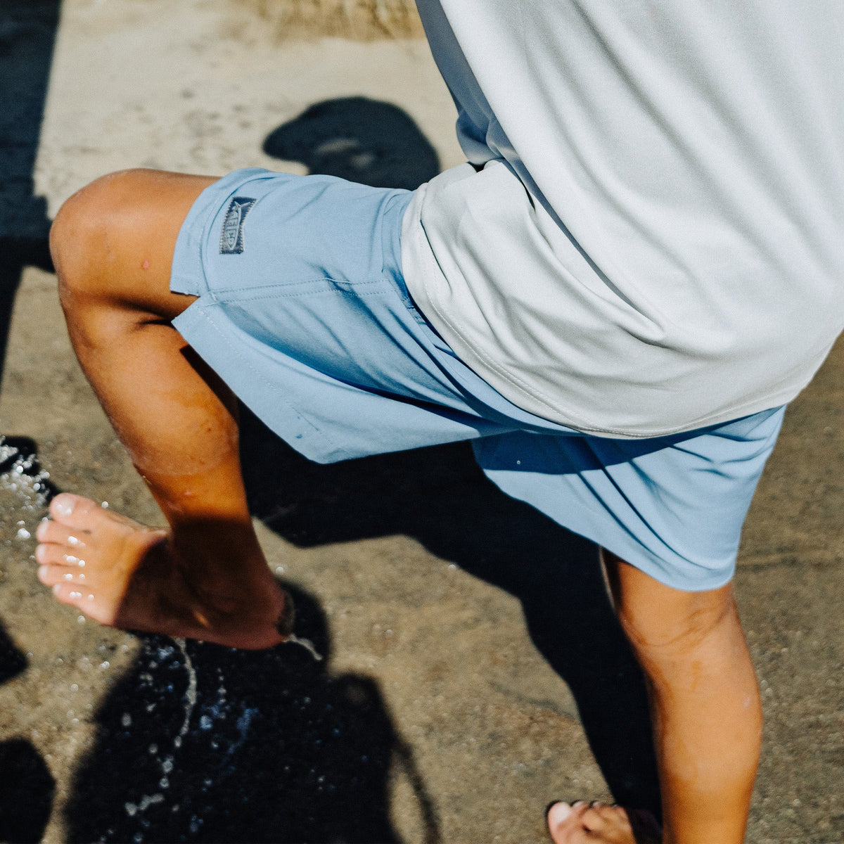 Coral Youth Strike Printed Swim Shorts / AFTCO Featured